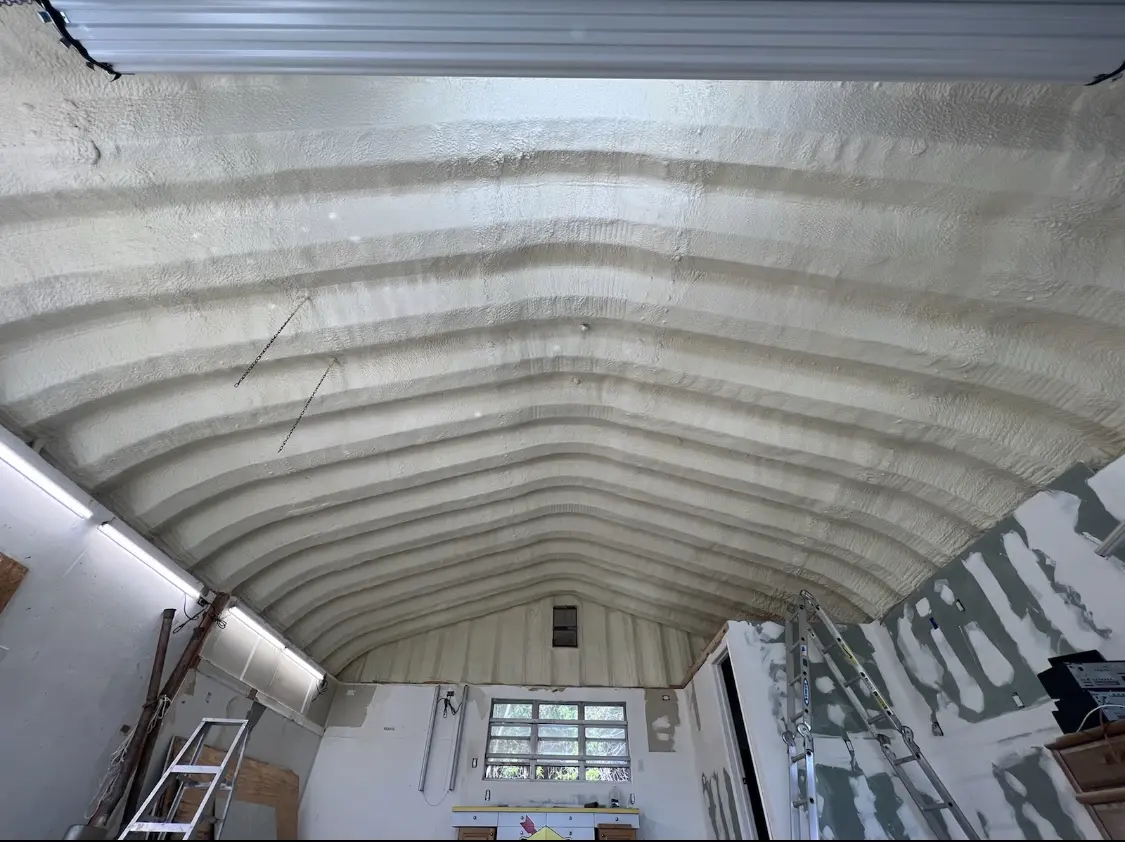Spray polyurethane foam applied to the underside of a metal roof deck in Larose